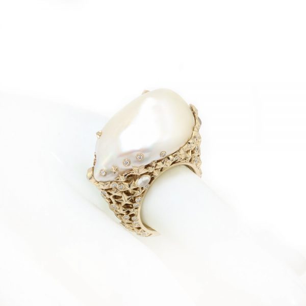 Bibi Van Der Velden Pearl Moonstone Diamond Ring; featuring a large baroque pearl encased in an 18ct yellow gold setting shaped into clusters of stars and set with moonstones and diamonds