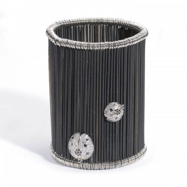 Diamond Butterfly and Ladybird Cuff Bracelet, set with 9.00 carats of black and white diamonds on anodised white gold twisted bars on sprung fittings