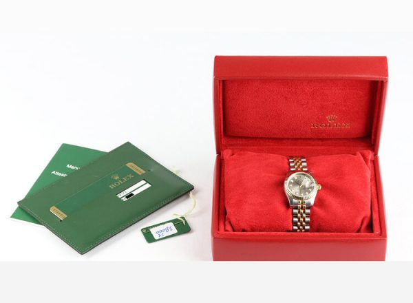 Rolex Lady Datejust Steel and Gold 179173 Automatic; 26mm case with Rolex factory original diamond dial, on a steel and gold Jubilee bracelet with Crownclasp, with Rolex box and papers, Circa 2011