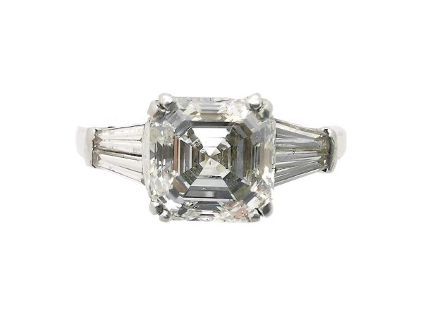 1.80ct Asscher Cut Diamond Ring in Platinum with Tapered Baguette Shoulders; central 1.80 carat asscher-cut diamond flanked either side by a tapered baguette-cut diamond set to the shoulders. Mounted in platinum