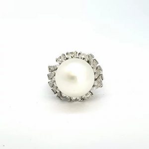 South Sea Pearl and Diamond Cluster Dress Ring; central 11.3mm South Sea pearl within a surround of brilliant and baguette-cut diamonds, in platinum