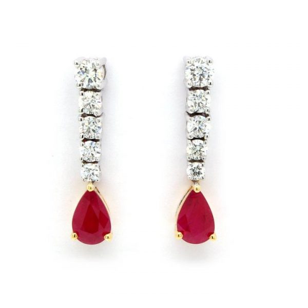 Pear Cut Ruby and Diamond Drop Earrings; pear-cut rubies hung from a row of five graduating brilliant cut diamonds. Sapphires 0.97cts. Diamonds 0.54cts