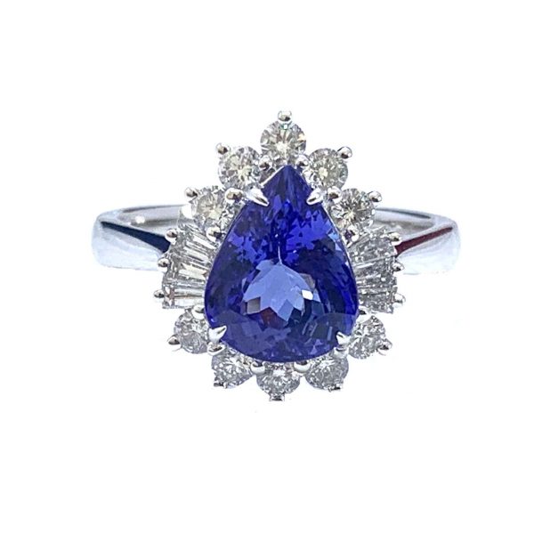 Pear Cut Tanzanite and Diamond Cluster Ring; 2.69 carat pear-cut tanzanite surrounded by brilliant and baguette-cut diamonds, in 18ct white gold