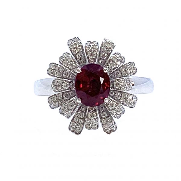 Burmese Ruby and Diamond Flower Cluster Dress Ring; 1.28ct oval faceted Burma ruby surrounded by diamond-set petals, in 18ct white gold