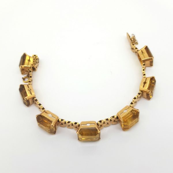 Vintage Citrine and 18ct Yellow Gold Bracelet; seven step cut citrine's, claw-set at equal spaces on a triple flat link gold bracelet