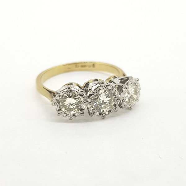 Vintage Diamond Three Stone Ring, 1.00 carat total, featuring three illusion set brilliant-cut diamonds, on a plain 18ct yellow gold shank, Circa 1970s