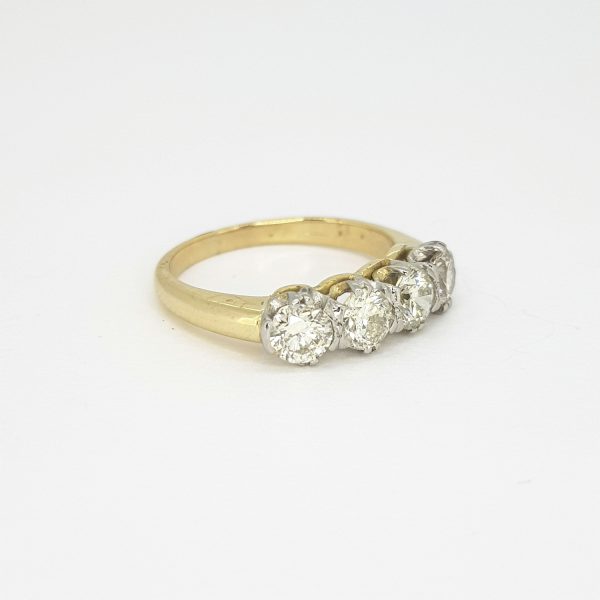 Modern Four Stone Diamond Ring; featuring four round brilliant-cut diamonds, 1.25 carat total, claw set, 18ct yellow gold