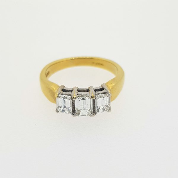 Emerald Cut Diamond Three Stone Ring; diamond trilogy ring set with three emerald-cut diamonds, 1.00 carat total, in 18ct yellow gold
