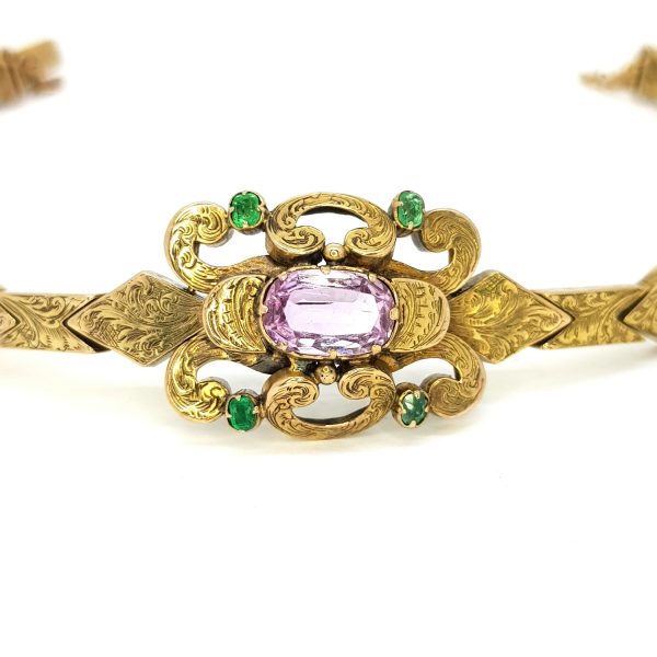 Antique Victorian Pink Topaz and Emerald set 15ct Gold Bracelet; central oval faceted pink topaz is set within scrolled design with a circular cut emerald to each corner