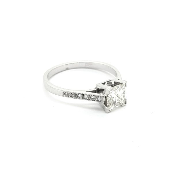 Princess Cut Diamond Solitaire Engagement Ring; featuring a modified square-cut diamond with brilliant-cut diamond set shoulders, in 18ct white gold