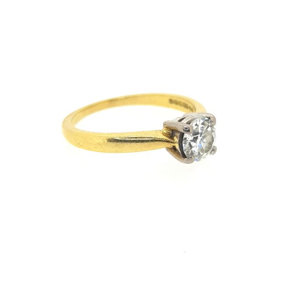 0.63ct Single Stone Diamond Solitaire Engagement Ring; 0.63 carat brilliant-cut diamond, four-claw set in 18ct white gold, on a plain 18ct yellow gold shank mount
