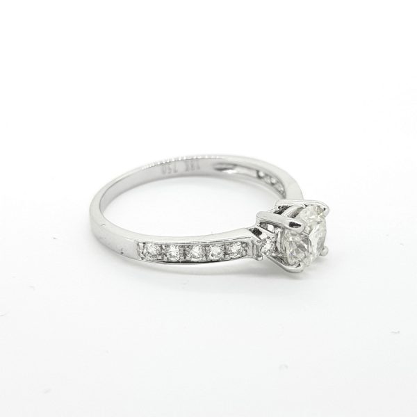 0.68ct Diamond Engagement Ring with Diamond Shoulders; 0.68 carat round brilliant-cut diamond, claw set, with diamond set shoulders, in 18ct white gold
