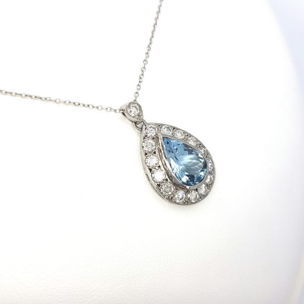 Aquamarine and Diamond Pear Shaped Cluster Pendant; 1.80ct pear-cut aquamarine surrounded by 1.00ct brilliant-cut diamonds, in 18ct white gold