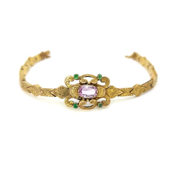 Antique Victorian Pink Topaz and Emerald set 15ct Gold Bracelet; central oval faceted pink topaz is set within scrolled design with a circular cut emerald to each corner