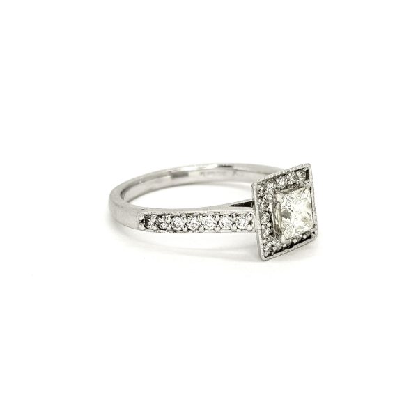 Princess Cut Diamond Cluster Ring; central 0.52 carat princess-cut diamond within a diamond set surround with diamond set shoulders, in 18ct white gold