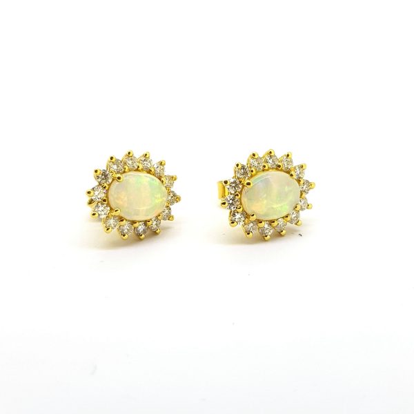 Opal and Diamond Oval Cluster Stud Earrings; featuring 1.15cts oval cabochon-cut opals surrounded by 0.71cts sparkling brilliant-cut diamonds, in 18ct yellow gold