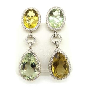 Contemporary Multi Colour Gemstone and Diamond Drop Earrings; oval and pear-shaped faceted lemon quartz and prasiolite within diamond surrounds and suspended from diamond set links, in 18ct white gold, 6cm overall length
