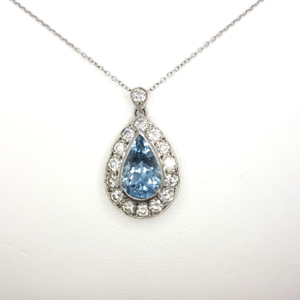 Aquamarine and Diamond Pear Shaped Cluster Pendant; 1.80ct pear-cut aquamarine surrounded by 1.00ct brilliant-cut diamonds, in 18ct white gold