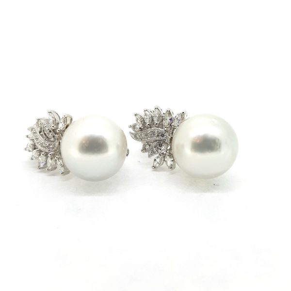 Southsea Pearl Earrings with Diamond set Leaf Tops; featuring 16mm Southsea pearls suspended from a leaf design top set with 1.85 carats of marquise cut and brilliant cut diamonds, in 18ct white gold