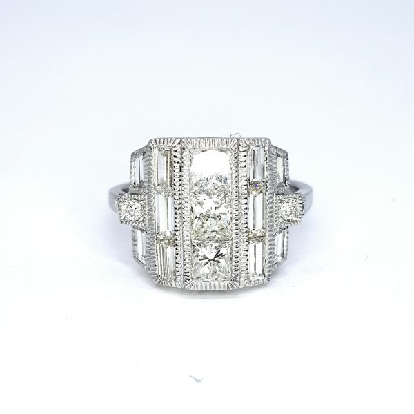 Diamond Dress Ring in 18ct White Gold, 2.63 carat total, three princess-cut diamonds flanked by baguette cut diamonds, brilliant-cut diamond set shoulders