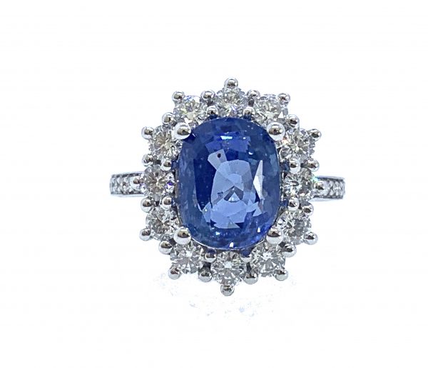sapphire and diamond Oval large cluster ring weighing 3.14 carats within a surround of round brilliant cut diamonds