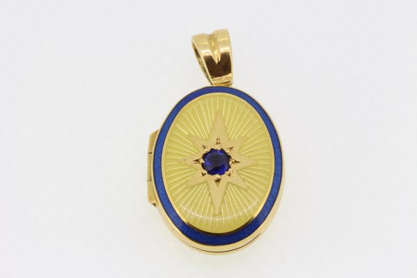 Deakin and Francis Gold Oval Locket; with central star design and blue enamel border