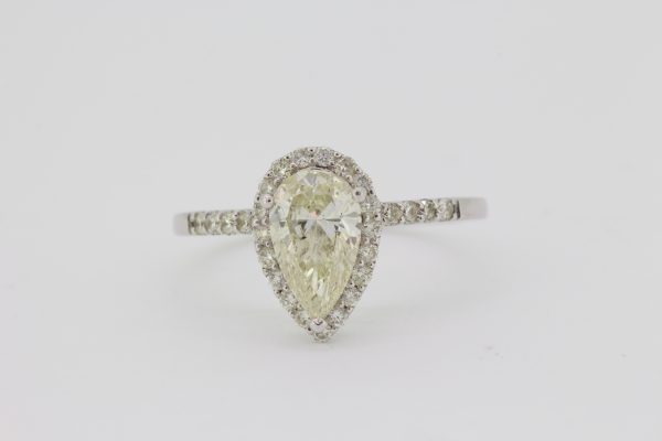 Pear Cut Diamond Cluster Ring; featuring a 1.04 carat pear-cut diamond with a 0.38ct brilliant-cut diamond surround, in 18ct white gold