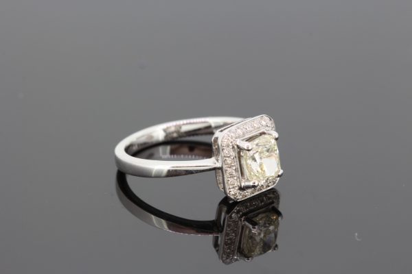Cushion Cut Diamond Square Shaped Halo Cluster Ring; central 1.03 carat cushion-cut diamond surrounded by a square-shaped diamond-set halo, in 18ct white gold