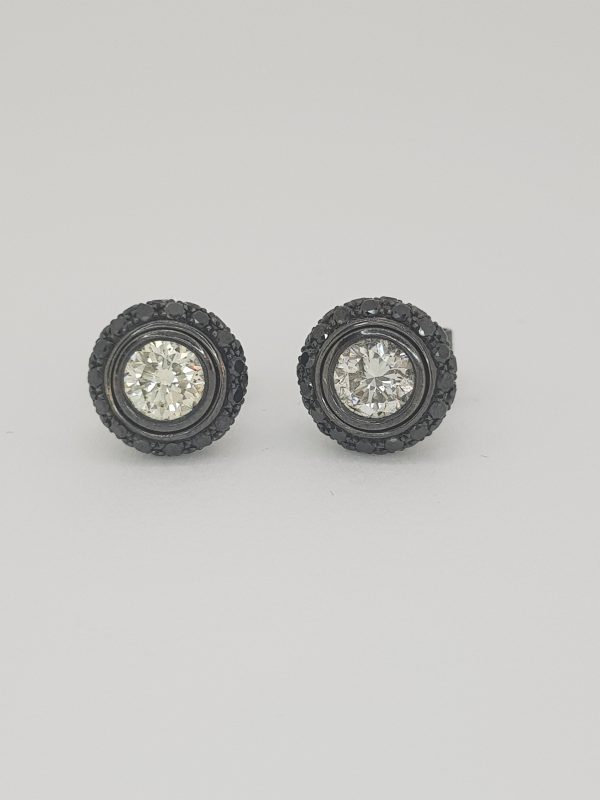 Black and White Diamond Stud Earrings, with Detachable Halos, in 18ct white gold. White diamonds 0.80 carats. Black diamonds 0.96 carats