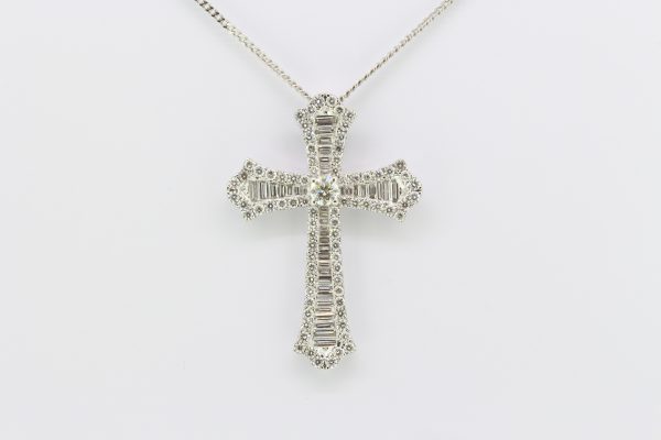 Baguette and Brilliant Diamond Cross Pendant in 18ct Gold; set with baguette-cut diamond bordered by round brilliant-cut diamonds, 3.60 carat total