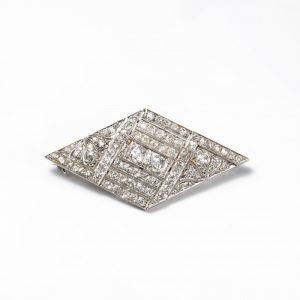 Art Deco Old Cut Diamond and Platinum Brooch; diamond-shaped plaque brooch set with 4.50 carats of old brilliant-cut diamonds in a geometric pattern