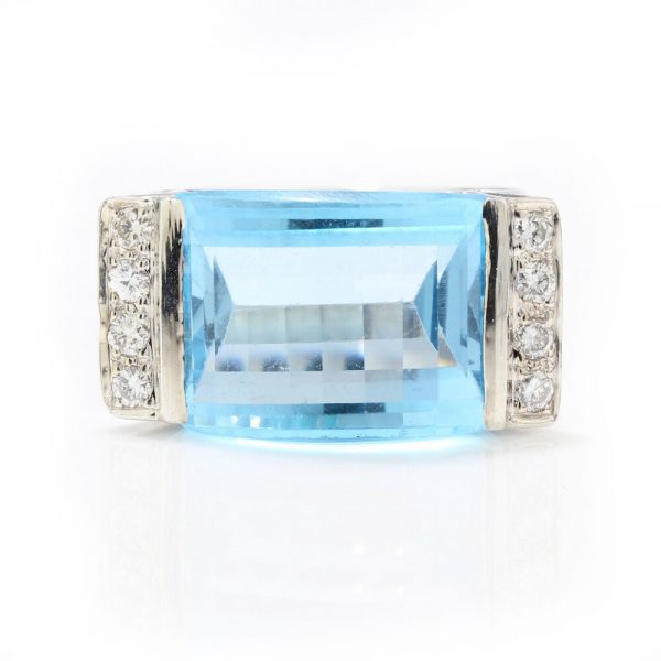 Vintage 8ct Natural Blue Topaz and Diamond Cocktail Ring; set with a large natural topaz of an assessed 8.00 carats, with diamonds to either side, in 18ct white gold, Circa 1970s