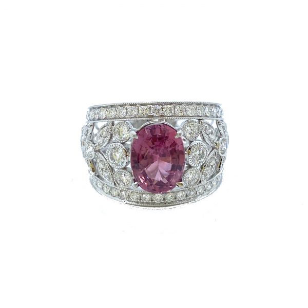 3.19ct Padparadscha Sapphire and Diamond Dress Ring by David Jerome; the central, unheated 3.19 carat oval faceted padparadscha sapphire is nestled upon a wide floral openwork band set with 1.56 carats of sparkling white diamonds, in 18ct white gold