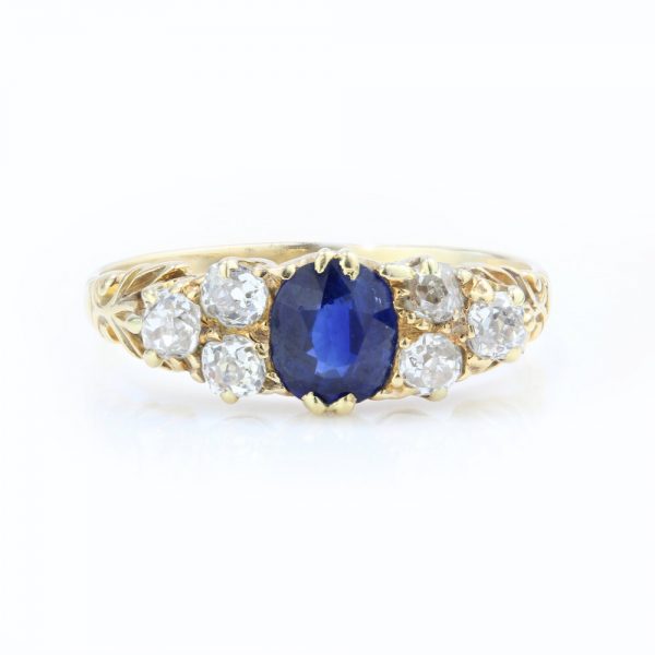 Antique Victorian Natural Sapphire and Old Cut Diamond Dress Ring; 0.50ct oval natural blue sapphire decorated by 0.42cts old cut diamonds, in 18ct yellow gold, Circa 1890s