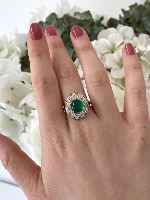 Cabochon Emerald and Diamond Cluster Ring in Platinum; 3.62ct cabochon-cut emerald with no oil within an oval white diamond and yellow sapphire surround