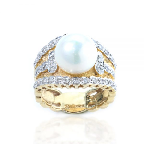 Vintage 1950s Pearl and Diamond Dress Ring; wide 18ct yellow gold cocktail ring set with a central freshwater pearl accented with 0.72cts diamonds. Circa 1950s-1960s