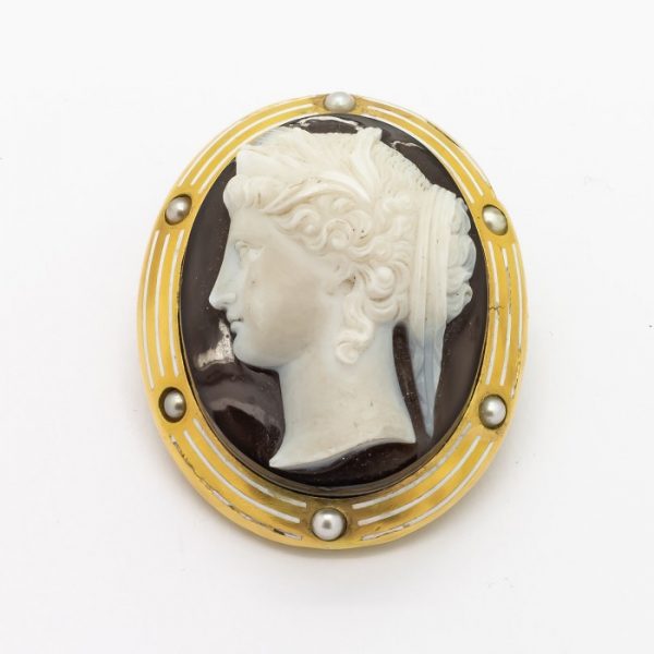 Antique Victorian Hera Cameo Sardonyx Natural Pearl and Gold Brooch; Hera the ancient Greek goddess on sardonyx hardstone cameo brooch, in 18ct yellow gold mount decorated with natural half pearls and white enamel, Circa 1890