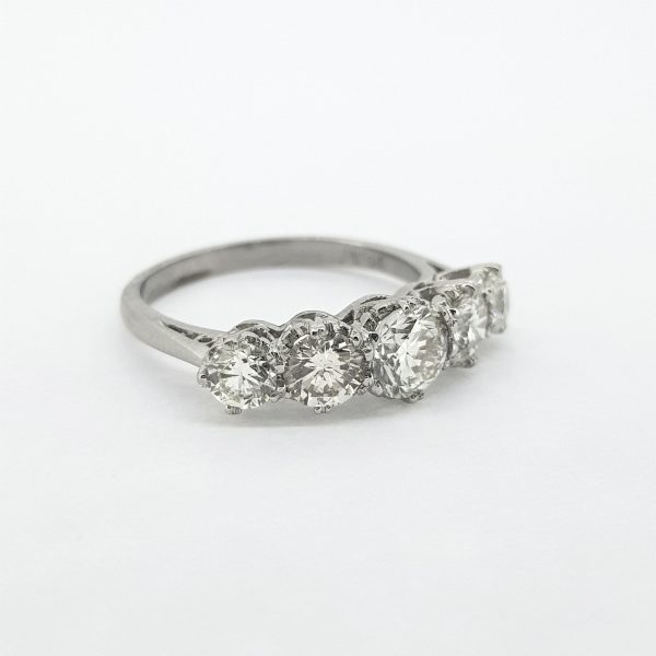 Five Stone Diamond Ring; set with five graduating diamonds, 2.00 carat total, claw set in open collets, mounted in platinum