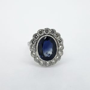 4.55ct Oval Sapphire and Diamond Floral Cluster Ring in 18ct White Gold