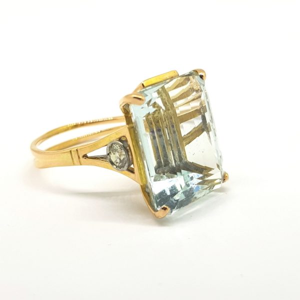 19.59ct Aquamarine and Diamond Cocktail Ring; stunning high set Aquamarine dress ring with detailed tension diamond set shoulders, in 18ct yellow gold