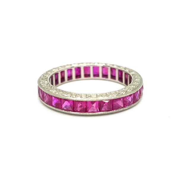 Princess Cut Ruby Full Eternity Band Ring in Platinum; set with fine French-cut rubies, with beautiful engraved edges, emulating the Art Deco style