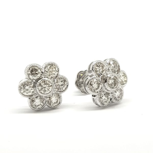 Diamond Daisy Flower Cluster Stud Earrings; set with 2.03 carats of round brilliant-cut diamonds, in 18ct white gold with millegrain edging