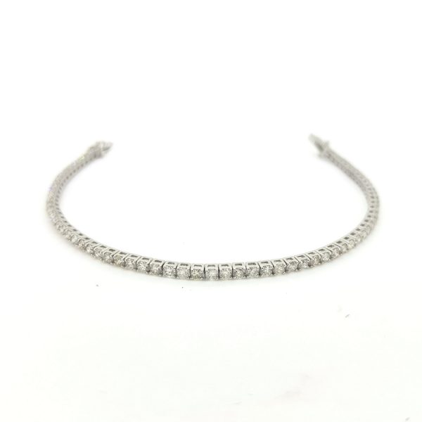 Diamond Line Bracelet in 18ct White Gold, 3.40 carat total, claw set with 70 round brilliant-cut diamonds, with push tongue clasp and two safety catches