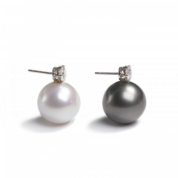 South Sea Pearl and Diamond Earrings; one black and one white South Sea cultured pearl, each topped with a round brilliant-cut diamond, 2.20 carat total, in white gold