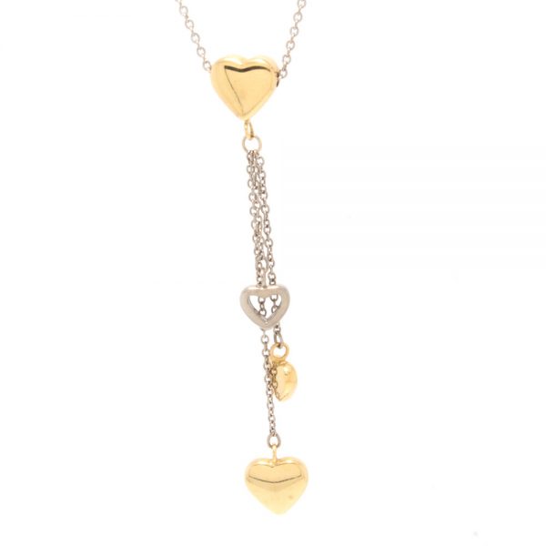 Tiffany and Co 18ct Yellow and White Gold Necklace with Heart Charm Pendants; Made in London, Circa 2000s, Comes in original Tiffany & Co travel pouch