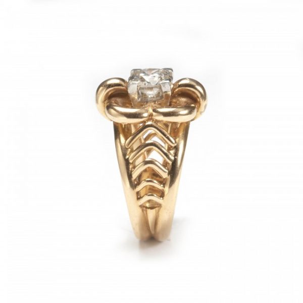 Vintage French 0.91ct Diamond Solitaire Dress Ring; single round brilliant-cut diamond, claw set within open floral frame with cut-out shoulders, in yellow gold, Circa 1950
