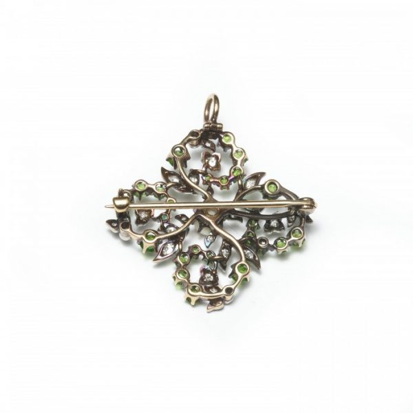 Antique Victorian Demantoid Garnet, Diamond and Pearl Brooch Pendant; round demantoid garnets and old cut diamonds set in an open quatrefoil design, with leaf motifs, around a central natural pearl