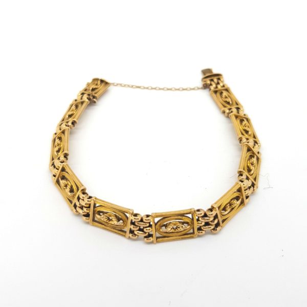 Antique Victorian 15ct Gold Panel Bracelet; comprised of solid 15ct yellow gold openwork detailed panels, with hidden clasp and safety chain, 18cm