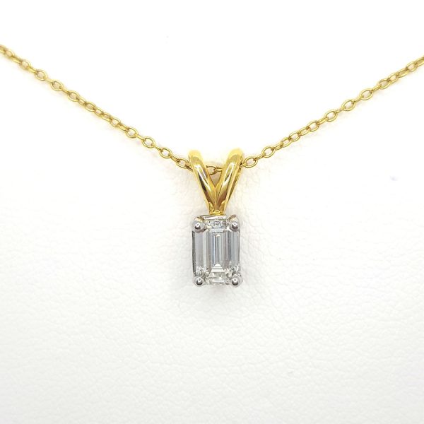 0.50ct Emerald Cut Diamond Pendant with Chain; 0.50 carat emerald-cut diamond four-claw set, on 18ct yellow gold bale, with yellow gold chain