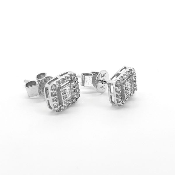 Modern Diamond Cluster Stud Earrings, 0.50 carats, each earring features three central baguette cut diamonds flanked by brilliant cut diamonds set to the top and bottom, all surrounded by a halo of 18 further brilliant cut diamonds in 18ct white gold